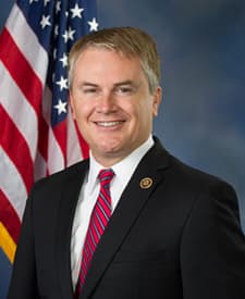 Official portrait of James Comer