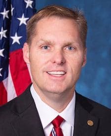 Official portrait of Michael Patrick Guest